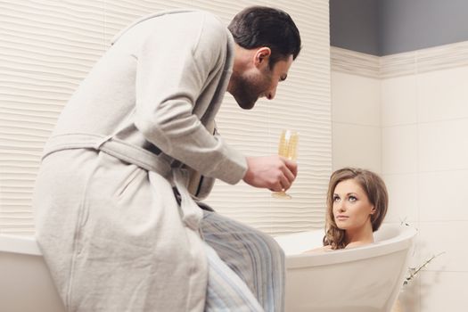 Young beautiful couple in the bathroom