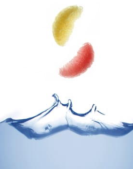 Orange in a water on a white background