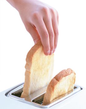 hand catches toast bread slices flying out of a toaster