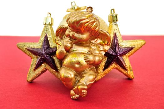 Angel and golden christmas stars baubles. Seasonal decoration.