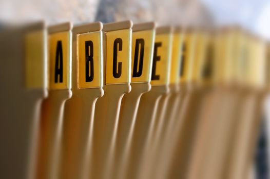 Alphabetical filing tray index office documents organizer. Selective focus.