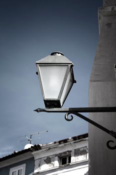 old street-lamp on house background