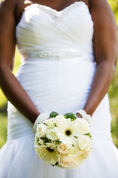 Black woman holding a wedding bouquet