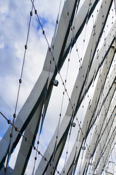 Urban composition with glass, stone, steel and blue sky.