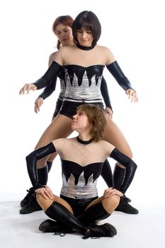 three dancers in same costumes on white
