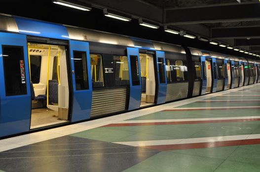 A train in the Stockholm subway waiting for departure at the beatiful station Kungsträdgården.