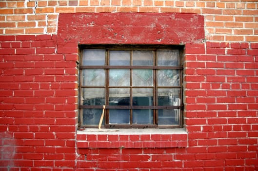 Old red brick wall with window