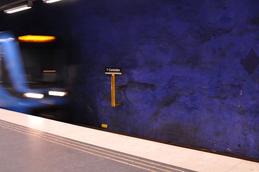 A train in the Stockholm metro entering station T-centralen.