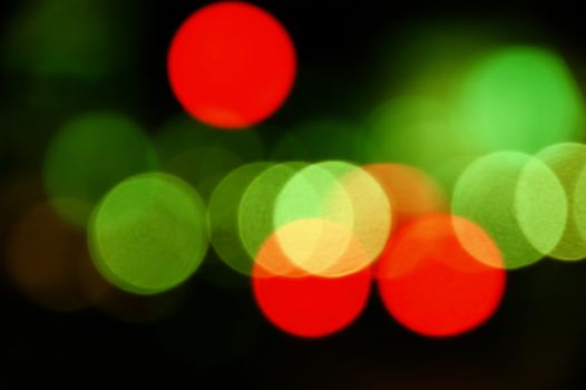 City traffic lights at night. Abstract blurry circles background.