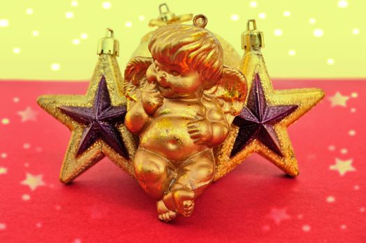 Cupid and golden stars baubles. Christmas decoration.