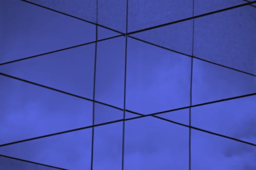 Glass building abstract exterior. Modern architecture facade blue lines background.