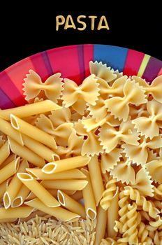 Dish with four kinds of italian pasta. Creative food background.