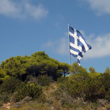Gigantic greek flag on mountain top. Zakynthos, Greece.