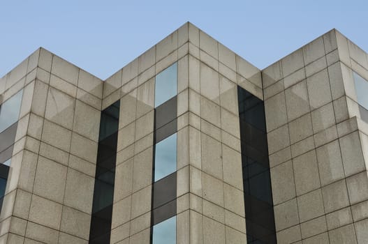 Modern building marble and glass facade corners abstract architecture background.
