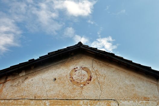 Abandoned neoclassical house roof. Architectural detail.