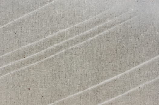 Plaster and gauze rough surface with rippled lines pattern. Background texture.