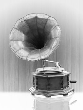 Vintage Gramophone with disc isolated on grunge background