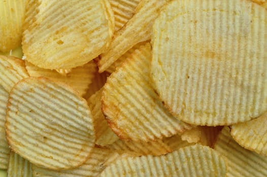 Potato chips food texture. Salty snack background.