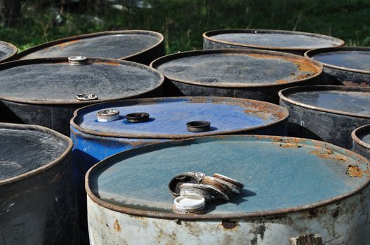 Rusty industrial metal barrels. Abstract background.