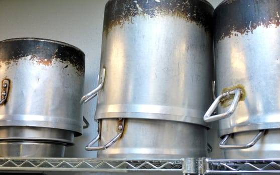 large kitchen pots inside a restaurant.