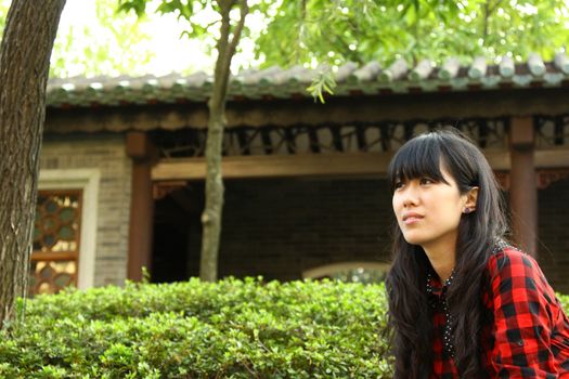 Chinese girl thinking outdoor