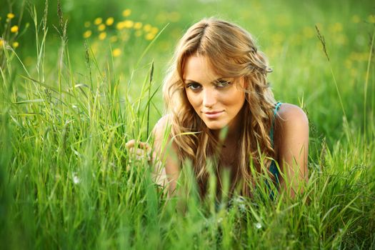 woman on the green grass happy and smile