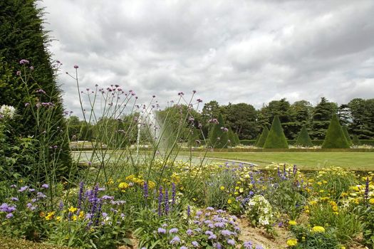 formal garden, flowers and fountain, water jet   France