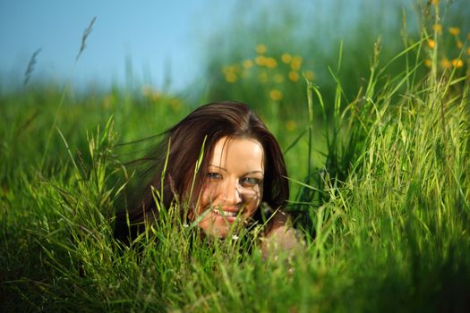  happy woman lay on green grass