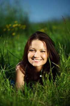  happy woman lay on green grass