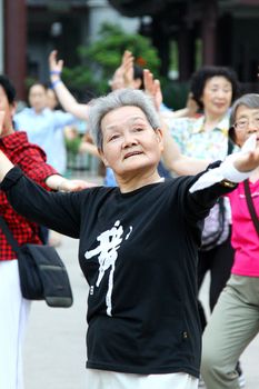 CHINA - MAY 9, A group on women dance on the street everyday in Zhangjiajie, China on 9 May, 2011. It shows the living of modern Chinese.