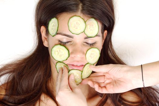 cucumbers circles on a girl face