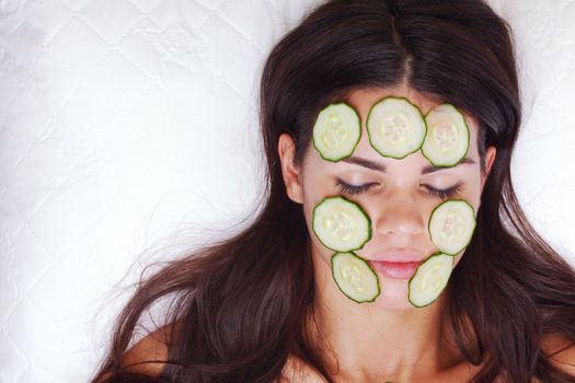 cucumbers circles on a girl face