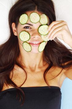 cucumbers circles on a girl face