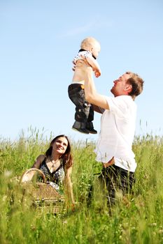 happy family in green grass