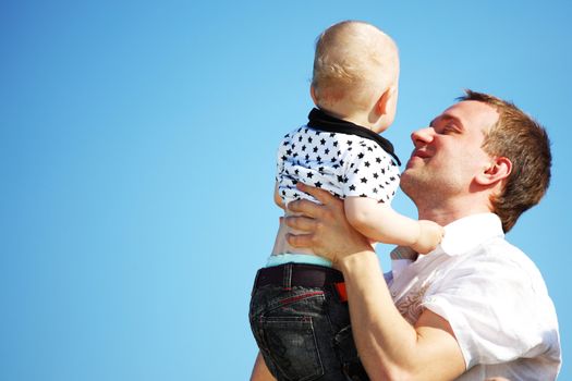 happy family blue sky on background