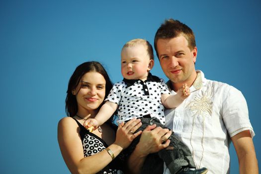 happy family blue sky on background