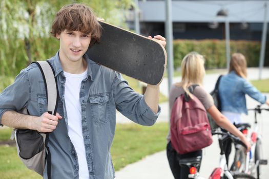 Student on campus with a skateboard