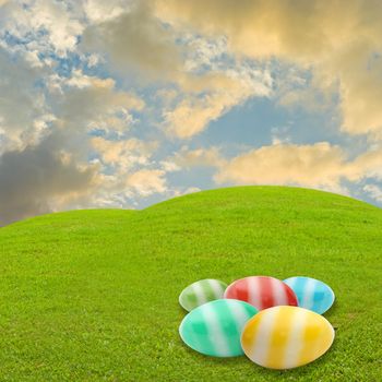 Easter egg in meadow with sky background