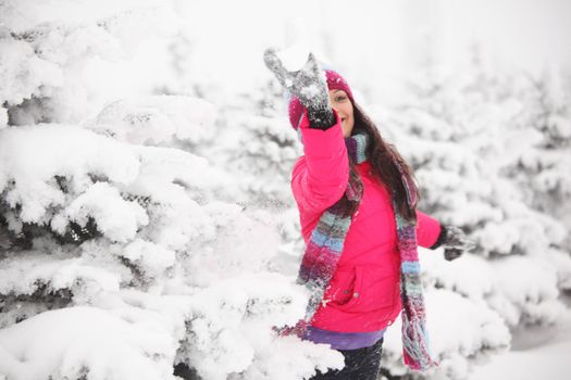 winter girl behind snow tree 