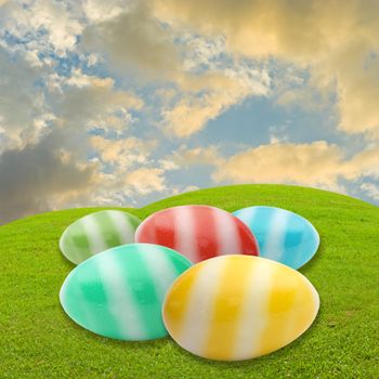 Easter egg in meadow with sky background