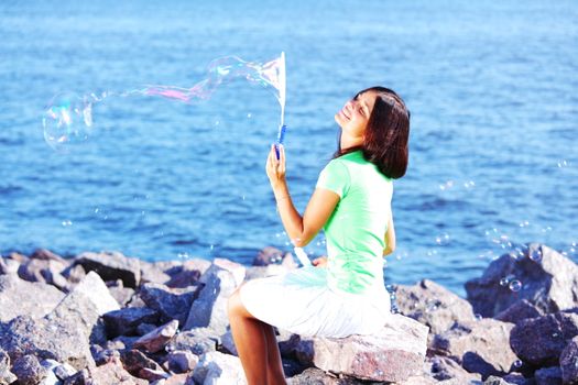 woman relax blue sea and bubbles on background