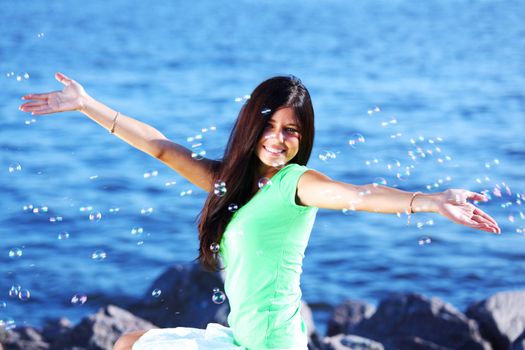 woman relax blue sea and bubbles on background