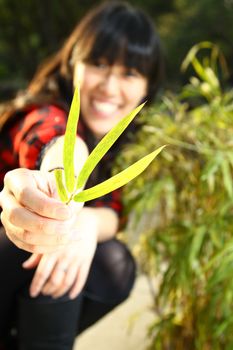 Asian woman smiling under sunshine