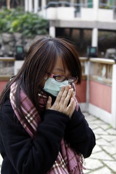 Asian sick girl wearing mask