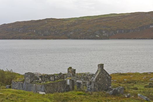 abandoned, ruined house at scottish coastline