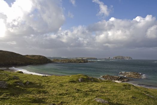 coastal landscape on scottish isle with wetland and hills