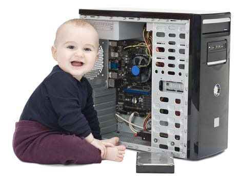 young child in blue shirt with open computer on white background