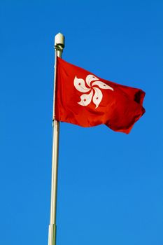 Hong Kong SAR flag under blue sky