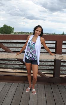 African American female beauty posing outside.