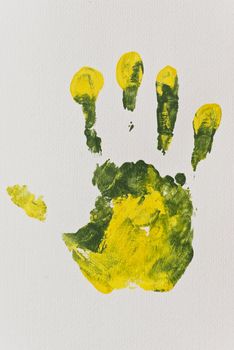 Green and Yellow Right Hand-print on Textured Paper